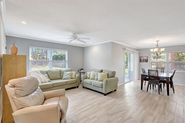 4420 Tecumseh Trl Unit 38, Sarasota, FL 34233 - living room with a chandelier, plenty of natural light, crown molding, ceiling fan, and baseboards