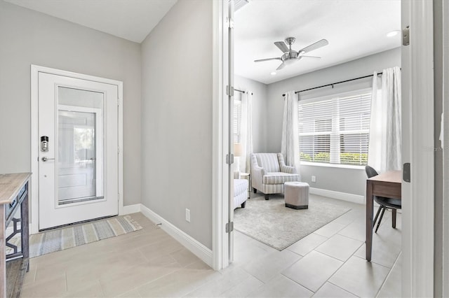 2894 Butterfly Jasmine Trl, Sarasota, FL 34240 - entrance foyer featuring baseboards, a ceiling fan, and light tile patterned floors
