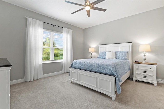 2894 Butterfly Jasmine Trl, Sarasota, FL 34240 - bedroom with light carpet, baseboards, and ceiling fan