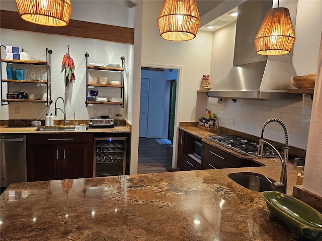 33 Tee View Pl, Rotonda West, FL 33947 - kitchen with beverage cooler, wall chimney range hood, open shelves, a sink, and dark stone counters