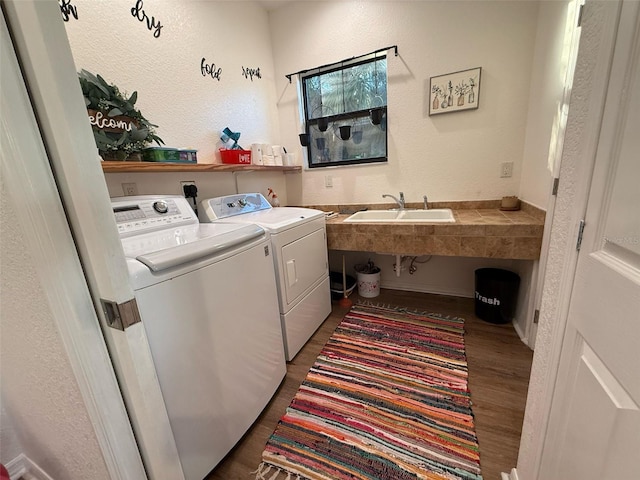 33 Tee View Pl, Rotonda West, FL 33947 - washroom with dark wood-style floors, washing machine and dryer, and a textured wall