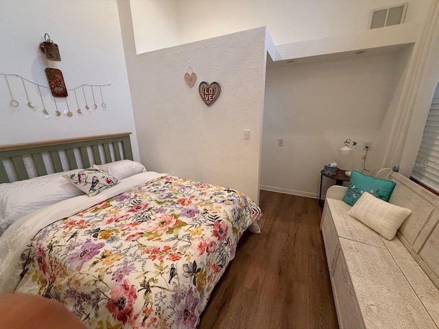 33 Tee View Pl, Rotonda West, FL 33947 - bedroom with dark wood-style flooring and baseboards