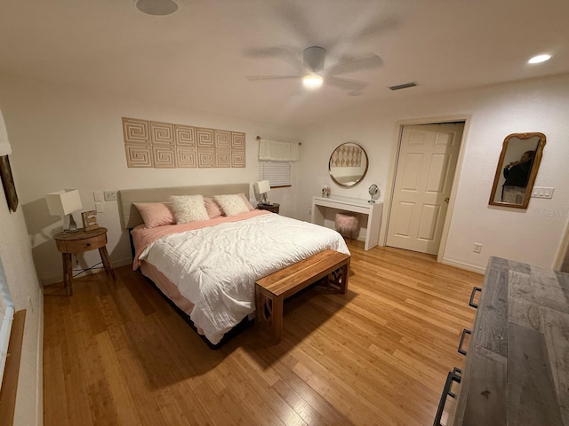 33 Tee View Pl, Rotonda West, FL 33947 - bedroom with light wood finished floors, baseboards, ceiling fan, and recessed lighting