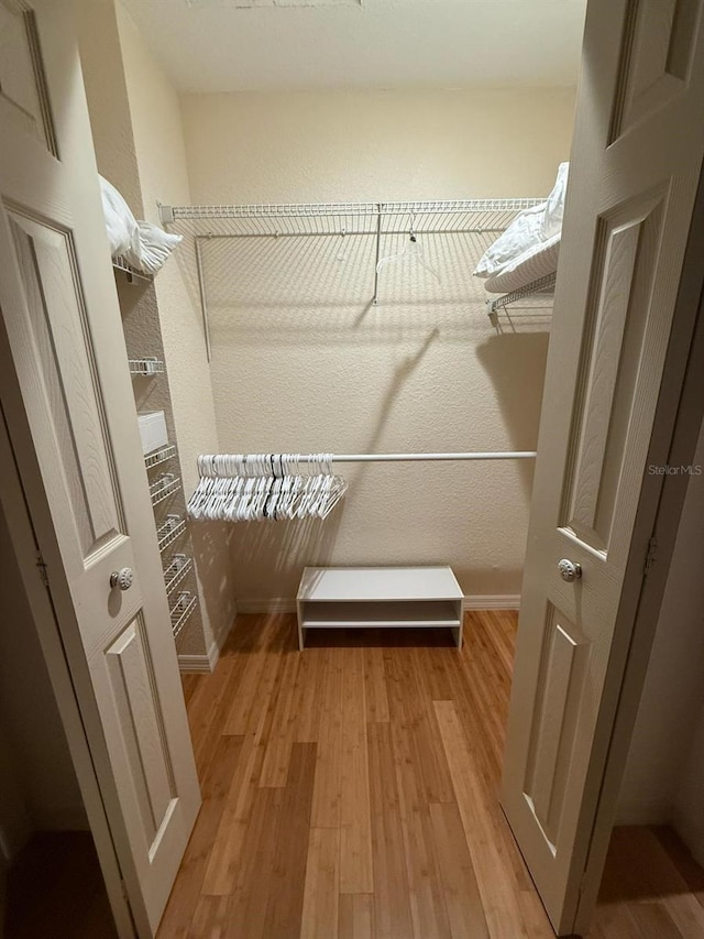 33 Tee View Pl, Rotonda West, FL 33947 - spacious closet with light wood finished floors