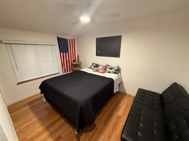 33 Tee View Pl, Rotonda West, FL 33947 - bedroom with light wood-style flooring, baseboards, and a ceiling fan