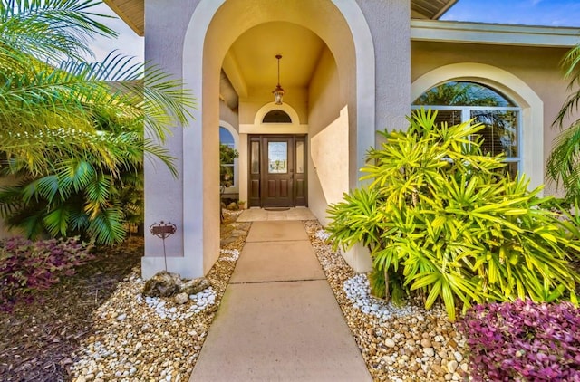 property entrance featuring stucco siding
