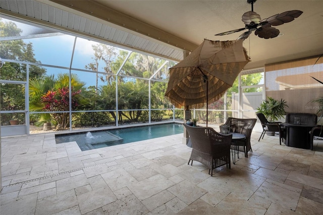 pool featuring a ceiling fan, glass enclosure, fence, and a patio area