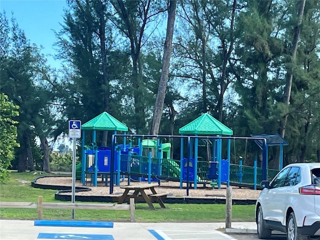 845 Benjamin Franklin Dr Unit 104, Sarasota, FL 34236 - communal playground featuring view of scattered trees