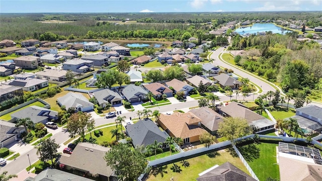 aerial view featuring a residential view and a water view