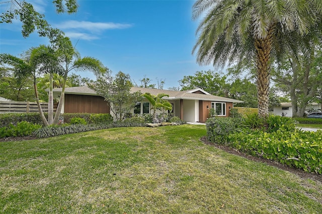 577 Corwood Dr, Sarasota, FL 34234 - view of front of property featuring fence and a front yard