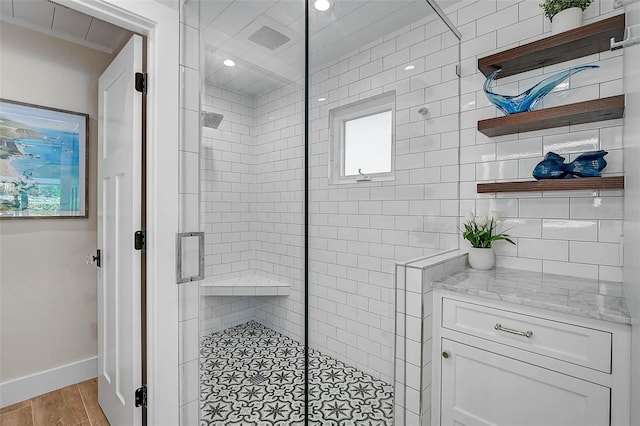 577 Corwood Dr, Sarasota, FL 34234 - full bathroom with a shower stall, baseboards, wood finished floors, and ornamental molding