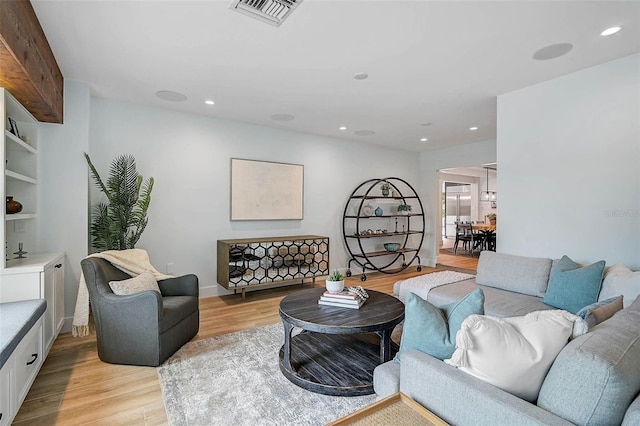 577 Corwood Dr, Sarasota, FL 34234 - living room featuring recessed lighting, baseboards, light wood finished floors, and visible vents