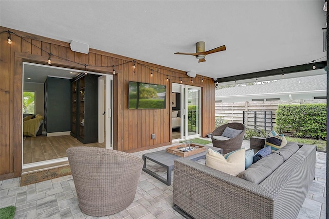 577 Corwood Dr, Sarasota, FL 34234 - view of patio / terrace featuring ceiling fan, fence, and an outdoor living space with a fire pit
