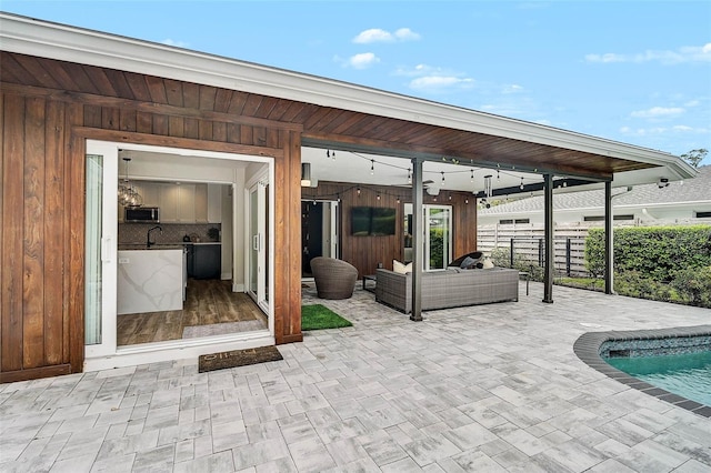 577 Corwood Dr, Sarasota, FL 34234 - view of patio / terrace featuring a fenced in pool, fence, and outdoor lounge area