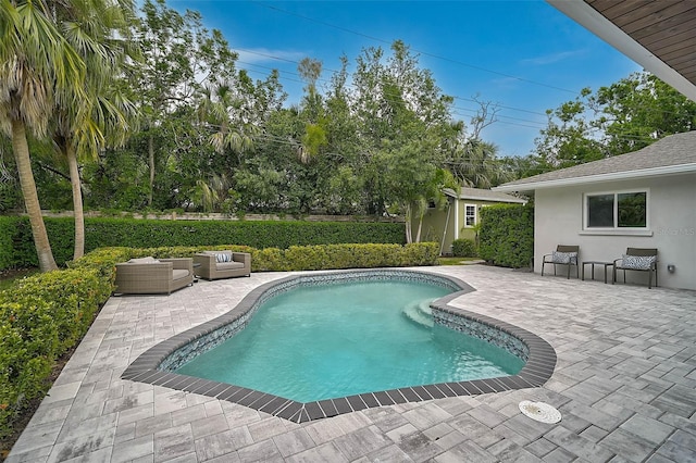 577 Corwood Dr, Sarasota, FL 34234 - view of swimming pool featuring a fenced in pool, an outbuilding, outdoor lounge area, and a patio