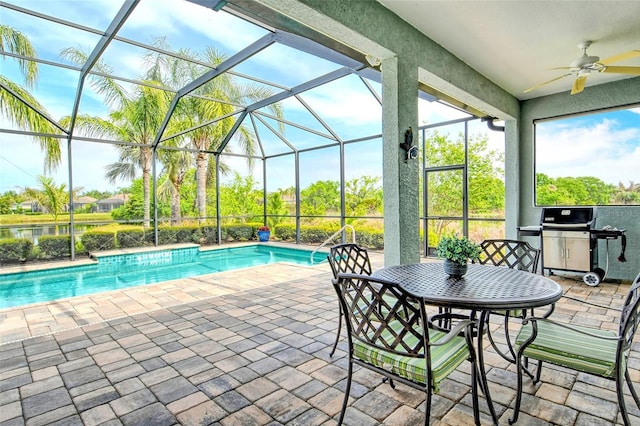 outdoor pool featuring a lanai, ceiling fan, and a patio