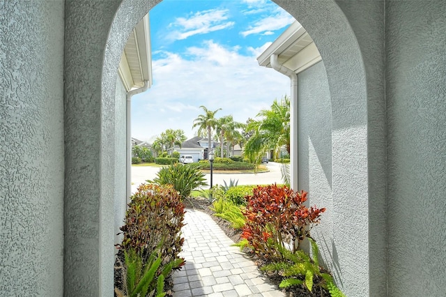 exterior space with a residential view and stucco siding