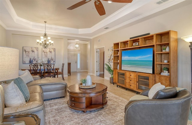 living area with a tray ceiling, ceiling fan with notable chandelier, crown molding, and baseboards