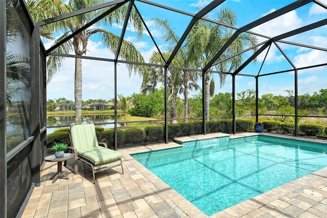 pool featuring a patio, a water view, and a lanai