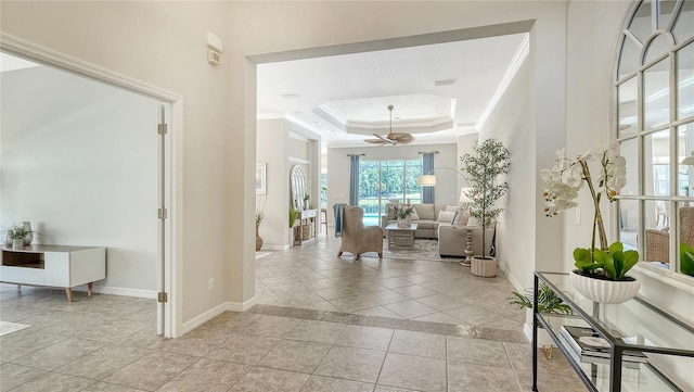 12041 Thornhill Ct, Lakewood Ranch, FL 34202 - foyer featuring a raised ceiling, crown molding, baseboards, and a ceiling fan