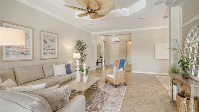 12041 Thornhill Ct, Lakewood Ranch, FL 34202 - living area with light tile patterned floors, baseboards, a ceiling fan, and ornamental molding