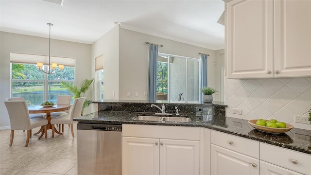12041 Thornhill Ct, Lakewood Ranch, FL 34202 - kitchen with a sink, stainless steel dishwasher, dark stone counters, and decorative backsplash