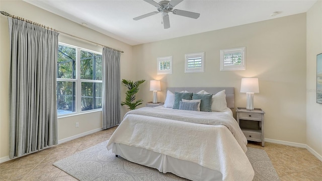 12041 Thornhill Ct, Lakewood Ranch, FL 34202 - bedroom featuring ceiling fan, light tile patterned floors, and baseboards