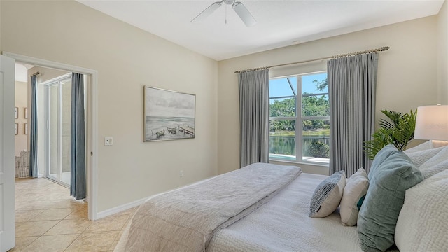 12041 Thornhill Ct, Lakewood Ranch, FL 34202 - bedroom with light tile patterned floors, baseboards, and ceiling fan