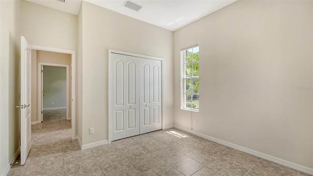 12041 Thornhill Ct, Lakewood Ranch, FL 34202 - unfurnished bedroom with a closet, visible vents, and baseboards