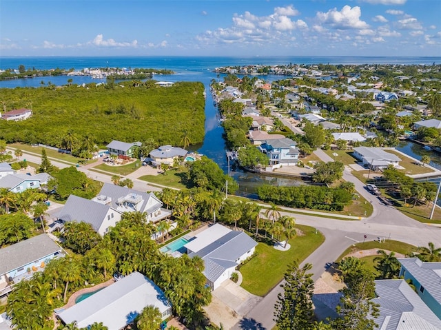 drone / aerial view with a water view and a residential view