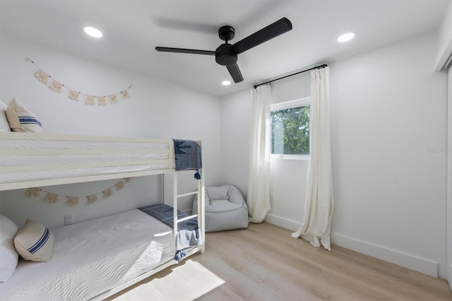 bedroom featuring light wood-type flooring, recessed lighting, baseboards, and a ceiling fan