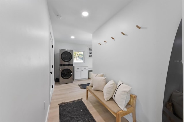hall with recessed lighting, light wood-style floors, and stacked washer / drying machine