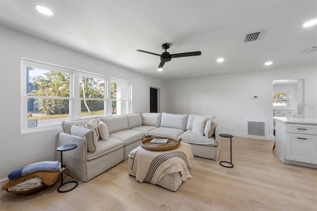 living area with visible vents, a ceiling fan, light wood-style flooring, and recessed lighting