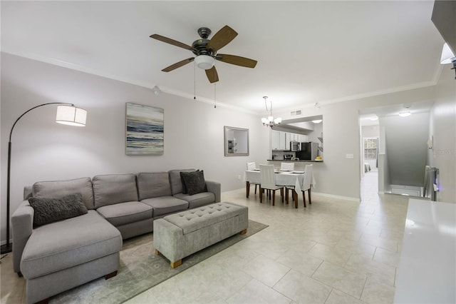 living area featuring light tile patterned flooring, baseboards, ceiling fan with notable chandelier, and ornamental molding