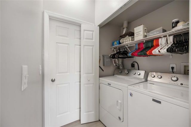 5691 Bentgrass Dr Unit 211, Sarasota, FL 34235 - laundry area with washer and clothes dryer