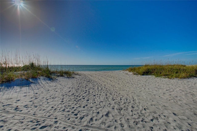 property view of water featuring a beach view