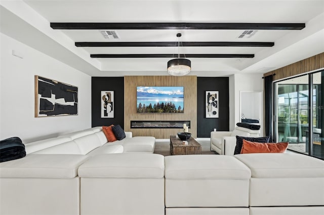 15104 Blue Bay Ter, Lakewood Ranch, FL 34211 - living room featuring beamed ceiling