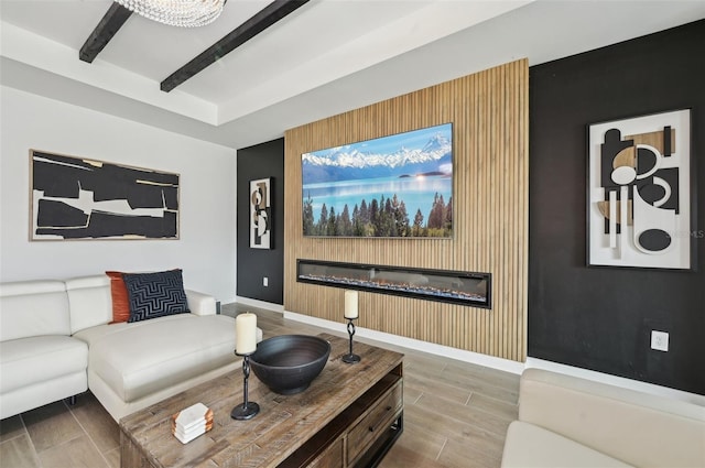 15104 Blue Bay Ter, Lakewood Ranch, FL 34211 - living area with wood finished floors, baseboards, and an accent wall