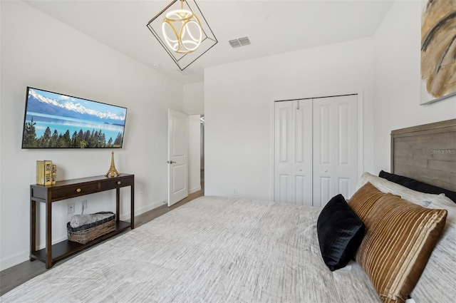 15104 Blue Bay Ter, Lakewood Ranch, FL 34211 - bedroom featuring wood finished floors, a closet, and baseboards