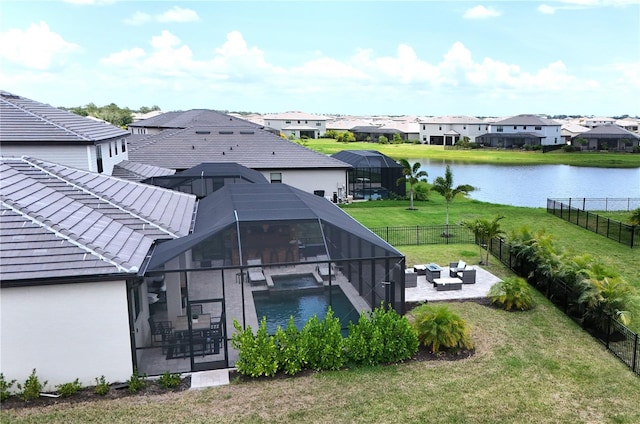 15104 Blue Bay Ter, Lakewood Ranch, FL 34211 - rear view of property featuring a patio area, a residential view, a water view, outdoor lounge area, and a tiled roof