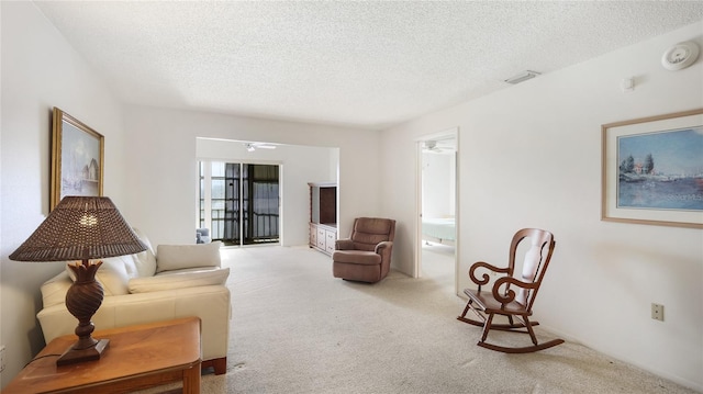 3763 Lake Bayshore Dr Unit 310, Bradenton, FL 34205 - carpeted living room with a textured ceiling and visible vents