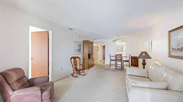 3763 Lake Bayshore Dr Unit 310, Bradenton, FL 34205 - living room with a textured ceiling, ceiling fan, and visible vents