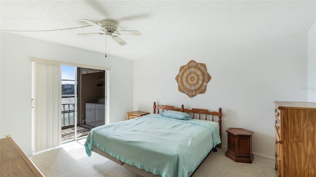 3763 Lake Bayshore Dr Unit 310, Bradenton, FL 34205 - bedroom with independent washer and dryer, access to outside, a textured ceiling, ceiling fan, and light carpet