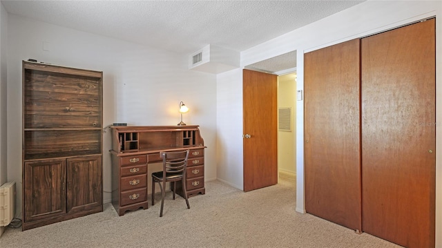 3763 Lake Bayshore Dr Unit 310, Bradenton, FL 34205 - office space featuring a textured ceiling, visible vents, and light carpet