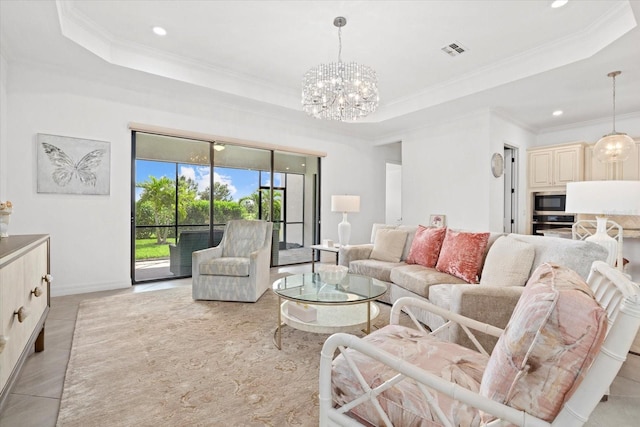 living area featuring a tray ceiling, ornamental molding, a chandelier, recessed lighting, and light tile patterned floors