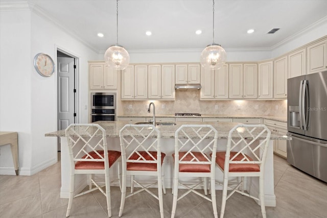 kitchen featuring stainless steel appliances, cream cabinetry, a sink, backsplash, and crown molding