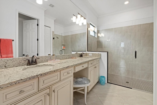 bathroom with ornamental molding, a shower stall, double vanity, and tile patterned flooring