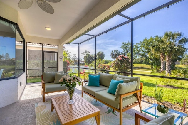 sunroom with an outdoor living space and a ceiling fan