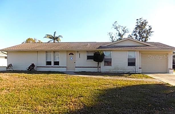 6309 35th Ave W, Bradenton, FL 34209 - ranch-style home featuring driveway, an attached garage, and a front lawn