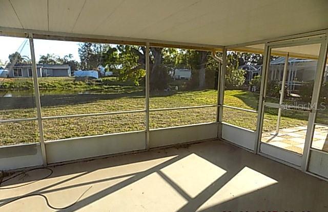 6309 35th Ave W, Bradenton, FL 34209 - unfurnished sunroom featuring a wealth of natural light